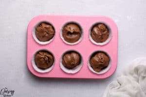 chocolate fudge muffins put in pan