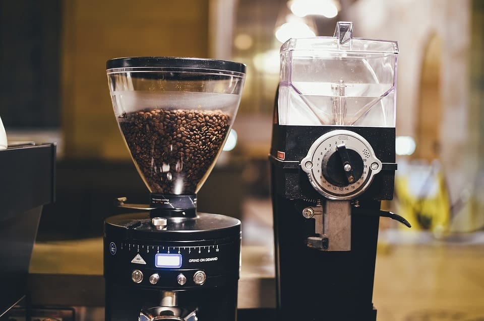 A pair of coffee grinders are pictured in a coffee shop